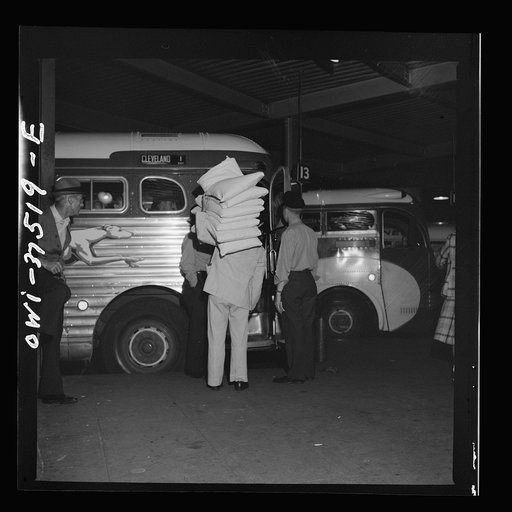 Cincinnati, Ohio. Pillows being loaded into a Greyhound bus
