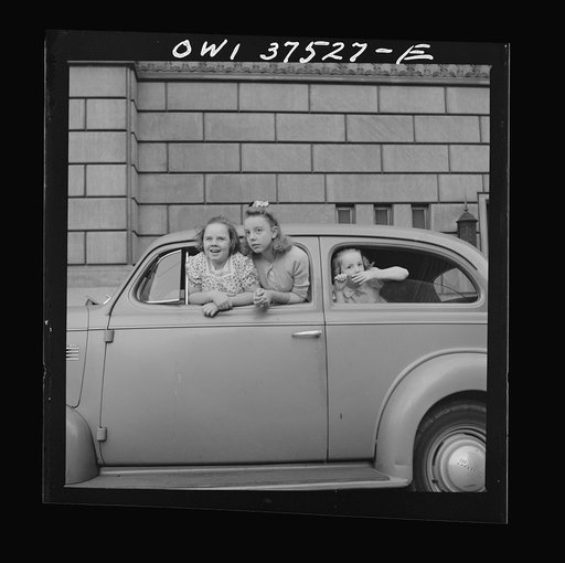 Cincinnati, Ohio. Mary Freda, Irma Jean, and Sue Anne Cochran, watching for their father, who is a Greyhound bus driver, to bring his bus into the terminal