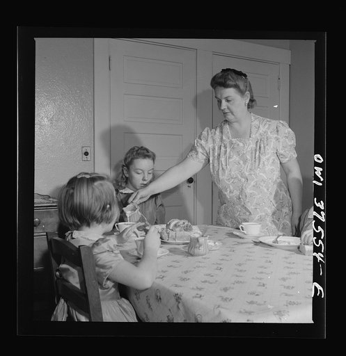 Cincinnati, Ohio. Mrs. Cochran, the wife of a Greyhound bus driver, giving the children Sunday breakfast