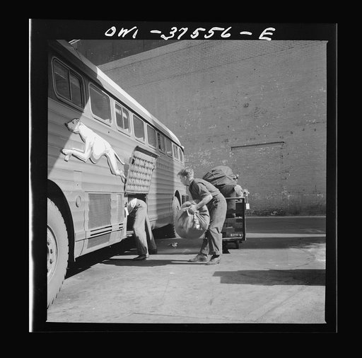Cincinnati, Ohio. Loading baggage on a Greyhound bus at the bus terminal