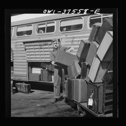 Cincinnati, Ohio. Loading baggage on a Greyhound bus at the bus terminal