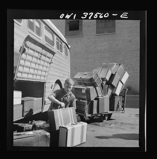 Cincinnati, Ohio. Loading baggage on a Greyhound bus at the bus terminal