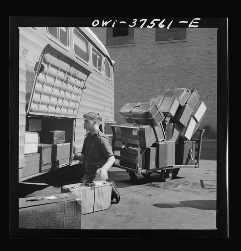 Cincinnati, Ohio. Loading baggage on a Greyhound bus at the bus terminal