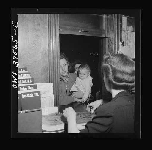 Cincinnati, Ohio. Asking for information at the ticket desk in the Greyhound bus terminal