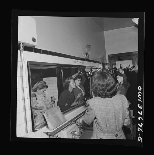 Untitled photo, possibly related to: Chicago, Illinois. Passengers freshening up in the ladies' restroom at the Greyhound bus terminal