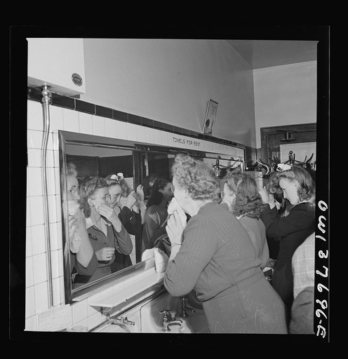 Chicago, Illinois. Passengers freshening up in the ladies' restroom at the Greyhound bus terminal