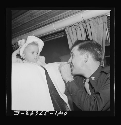 A lieutenant getting acquainted with one of the passengers on a Greyhound bus enroute from Cincinnati, Ohio to Louisville, Kentucky. He makes this trip almost every weekend to visit relatives