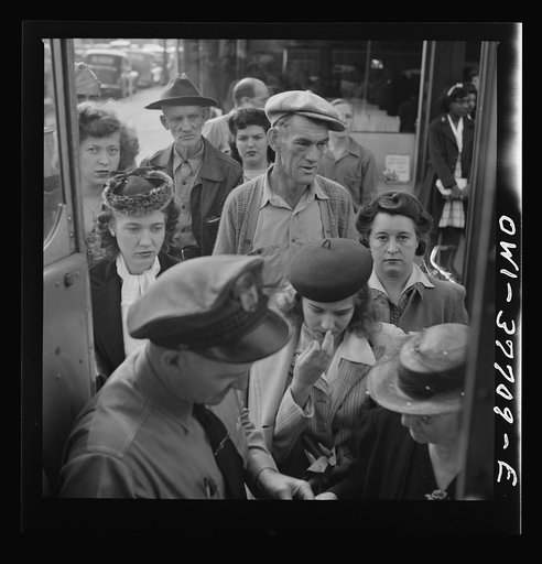 People boarding a Greyhound bus at a small town between Chicago, Illinois and Cincinnati, Ohio