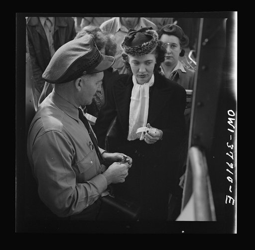 People boarding a Greyhound bus at a small town between Chicago, Illinois and Cincinnati, Ohio