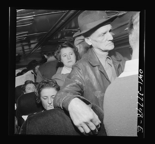 Passengers on a Greyhound bus going from Chicago, Illinois to Cincinnati, Ohio. Most of the standing passengers are local fares going from their farms to town