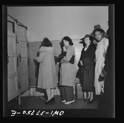 Indianapolis, Indiana. Bus passengers waiting in line to use the free toilet in the ladies' restroom at the Greyhound bus terminal