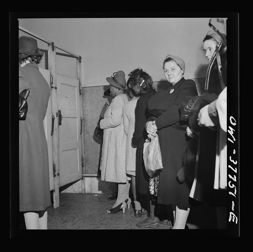 Indianapolis, Indiana. Bus passengers waiting in line to use the free toilet in the ladies' restroom at the Greyhound bus terminal
