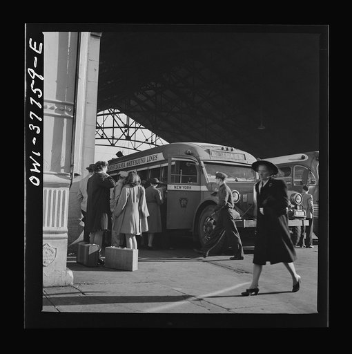Indianapolis, Indiana. An old-type bus being boarded by passengers in the Greyhound bus terminal. The drivers call this type of bus a "dive bomber." These buses are about ten years old and have been completely rebuilt