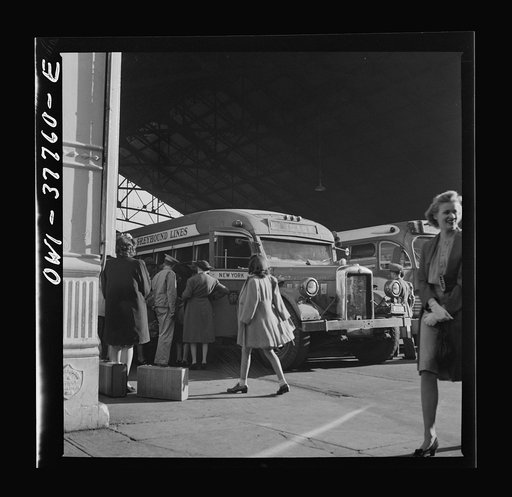 Indianapolis, Indiana. An old-type bus being boarded by passengers in the Greyhound bus terminal. The drivers call this type of bus a "dive bomber." These buses are about ten years old and have been completely rebuilt