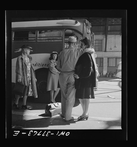 Indianapolis, Indiana. A soldier and a girl saying goodbye at the Greyhound bus station