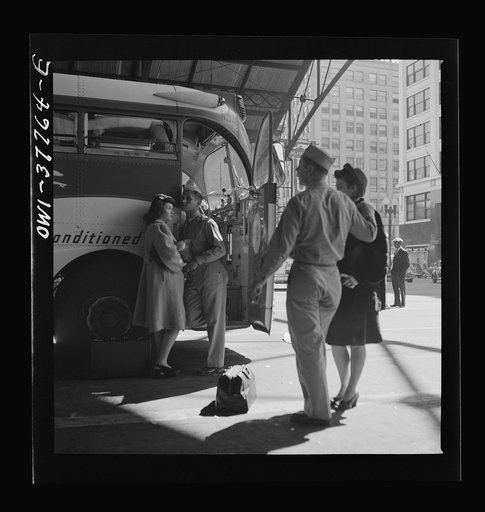 Indianapolis, Indiana. Soldiers with their girls in front of the Greyhound bus