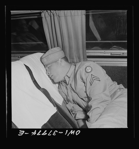 A soldier sleeping on the way from Cincinnati, Ohio to Louisville, Kentucky on a Greyhound bus