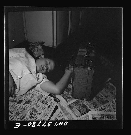 Louisville, Kentucky. A bus passenger sleeping on the floor at the Greyhound bus terminal because she had a nine hour stopover and all the benches were full