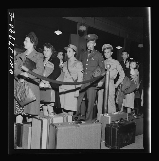 Chicago, Illinois. Passengers waiting for a bus to start loading at the Greyhound bus terminal