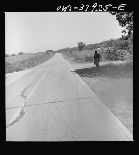 A Greyhound bus trip from Louisville, Kentucky, to Memphis, Tennessee, and the terminals. Waiting for the bus at the edge of the road. Enroute Chattanooga to Rome, Georgia