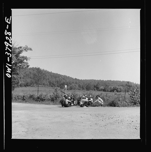 A Greyhound bus trip from Louisville, Kentucky, to Memphis, Tennessee, and the terminals. Men sitting by roadside on Sunday afternoon, between Memphis and Chattanooga