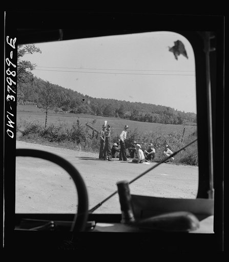 A Greyhound bus trip from Louisville, Kentucky, to Memphis, Tennessee, and the terminals. Men sitting by road side on Sunday afternoon, between Memphis and Chattanooga