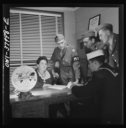 A Greyhound bus trip from Louisville, Kentucky, to Memphis, Tennessee, and the terminals. At travelers' aid desk in the bus terminal at Memphis, Tennessee. Servicemen ask for help in finding rooms, quickest route to get home, etc.