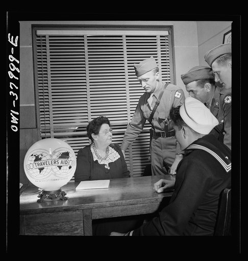 A Greyhound bus trip from Louisville, Kentucky, to Memphis, Tennessee, and the terminals. At travelers' aid desk in the bus terminal at Memphis, Tennessee. Servicemen ask for help in finding rooms, quickest route to get home, etc.