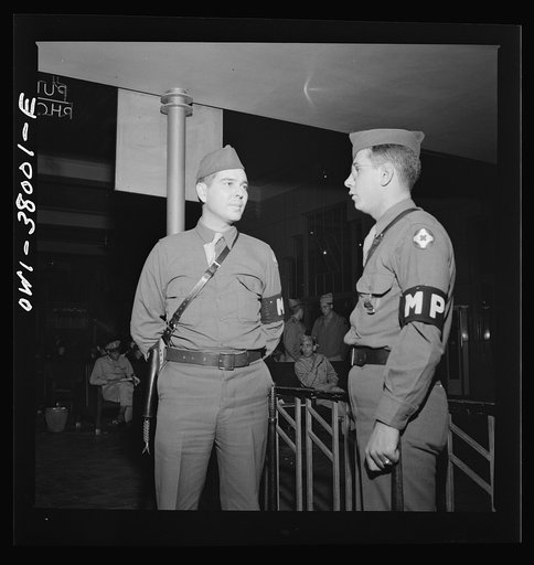 A Greyhound bus trip from Louisville, Kentucky, to Memphis, Tennessee, and the terminals. M.P. (Military Police) on duty at the bus station at Memphis, Tennessee