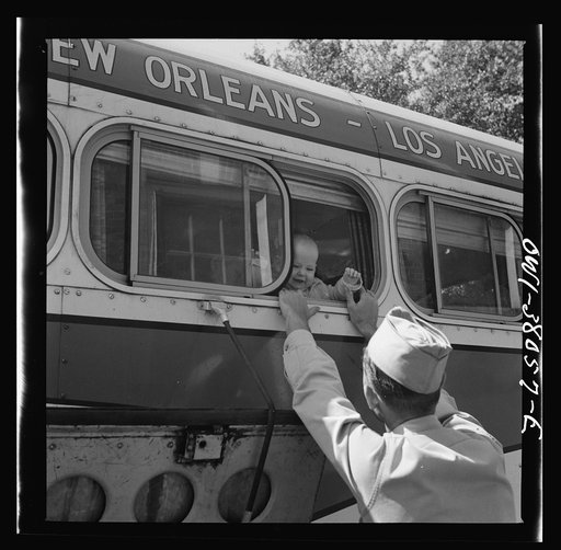 Bus trip from Knoxville, Tennessee to Washington, D.C. Soldier saying goodbye to his wife and child at small town in Tennessee