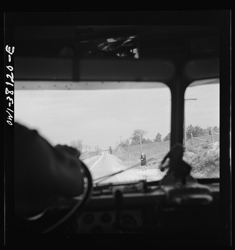 Bus trip from Knoxville, Tennessee, to Washington, D.C. Woman waiting for bus on highway in Tennessee