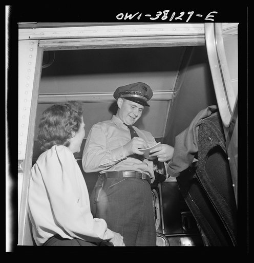 Bus trip from Knoxville, Tennessee, to Washington, D.C. Bus driver signing for manifest baggage which has been loaded on his bus. He is now responsible for it