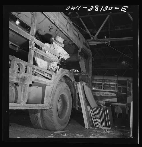 Bus trip from Knoxville, Tennessee, to Washington, D.C. Working on an old type coach which is being completely rebuilt at the garage of the Tennessee Coach Company in Knoxville, Tennessee