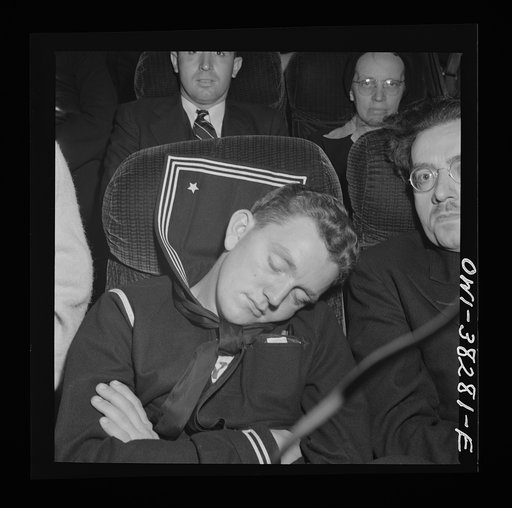 A sailor asleep on a bus enroute from Roanoke, Virginia to Washington, D.C.