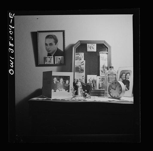 Washington, D.C. Pictures of her husband decorate the dresser and mirror of this boardinghouse resident