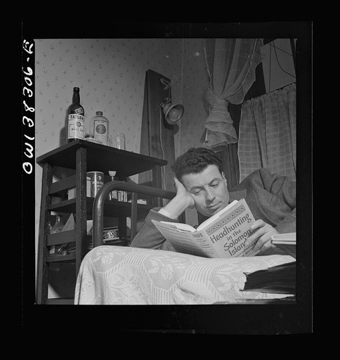Washington, D.C. A clerk in the U.S. Navy Department reading in his room in a boardinghouse