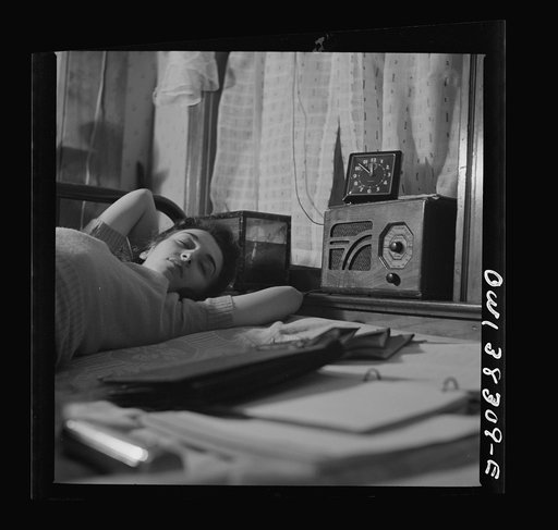 Washington, D.C. A radio is company for this girl in her boardinghouse room