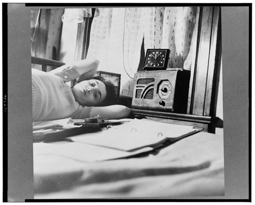 Washington, D.C. A radio is company for this girl in her boardinghouse room