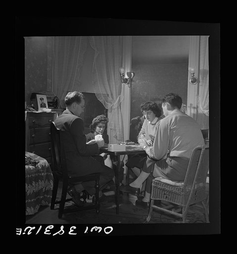 Washington, D.C. After dinner a bridge game goes on nightly in the largest room in the boardinghouse