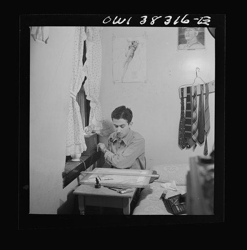 Washington, D.C. This employee of the U.S. Navy Department listens to the radio and studies drafting in his boardinghouse room