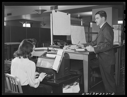 Washington, D.C. The U.S. Weather Bureau station at the National Airport. Weather forecast being prepared and transmitted over teletype for the Washington forecast district