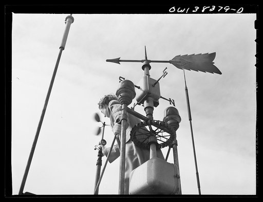 Washington, D.C. The U.S. Weather Bureau station at the National Airport. Wind direction and velocity are measured by these devices. The instruments are known as wind vanes and anemometers