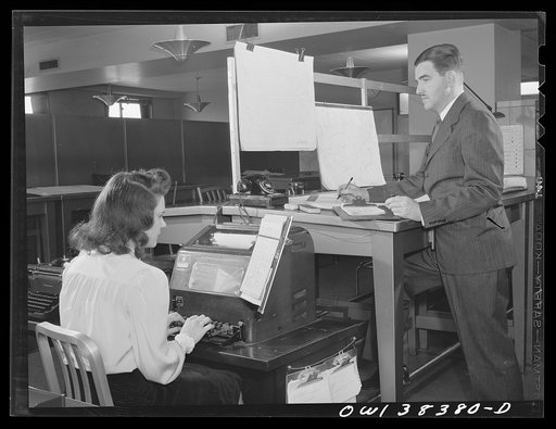 Washington, D.C. The U.S. Weather Bureau station at the National Airport. Weather forecast being prepared and transmitted over teletype for the Washington forecast district
