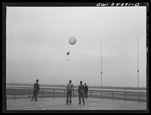 Washington, D.C. The U.S. Weather Bureau station at the National Airport. Atmospheric conditions are transmitted by a weather radio instrument attached to the balloon which ascends to heights of fifteen to twenty miles