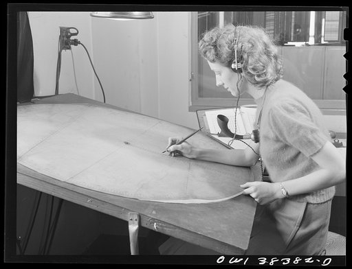Washington, D.C. The U.S. Weather Bureau station at the National Airport. Plotting the course of a pilot balloon as it ascends into the atmosphere to determine the velocity and direction of winds above the surface