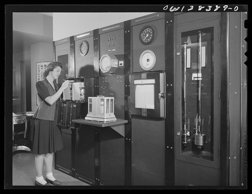 Washington, D.C. The U.S. Weather Bureau station at the National Airport. Surface weather being observed at a Weather Bureau instrument panel on which are mounted barometers, thermometers, wind direction and velocity indicators, and other instruments for measuring weather elements
