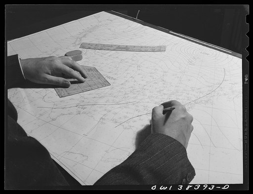 Washington, D.C. The U.S. Weather Bureau station at the National Airport. Weather observations being analyzed by a district forecaster preparatory to issuing a weather forecast
