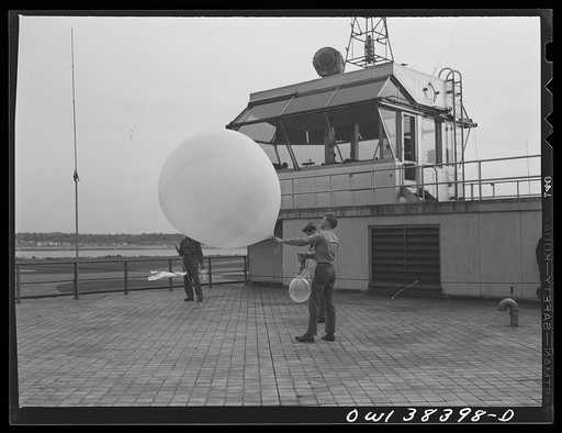 Washington, D.C. The U.S. Weather Bureau station at the National Airport. Atmospheric conditions are transmitted by a weather radio instrument attached to the balloon which ascends to heights of fifteen to twenty miles
