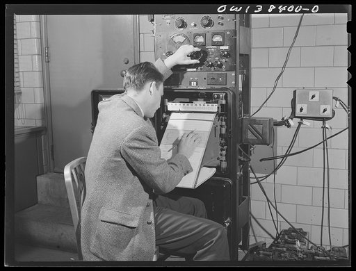 Washington, D.C. The U.S. Weather Bureau station at the National Airport. High frequency radio receiver recording signals from small radio transmitter attached to radiosonde balloon aloft. The signals reveal temperature, humidity and pressure at various altitudes