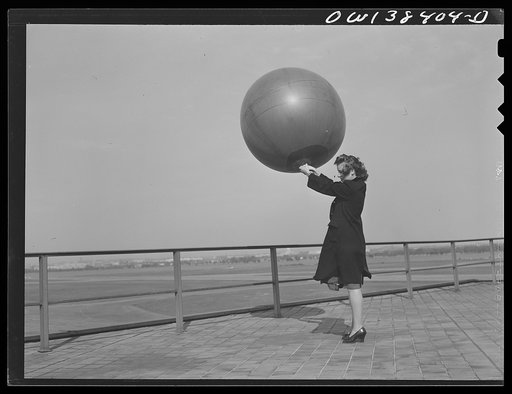 Washington, D.C. The U.S. Weather Bureau station at the National Airport. Pilot balloon being released to determine wind direction and velocity aloft